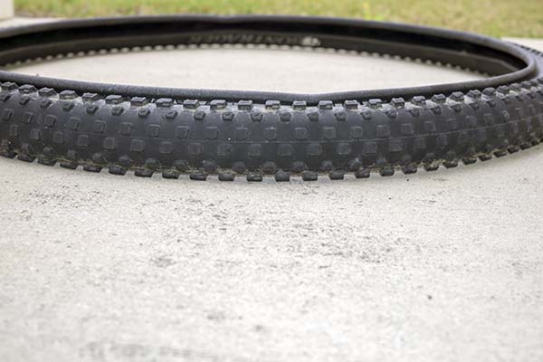 Photograph of bicycle tire with everted (rolled outward) tire bike.